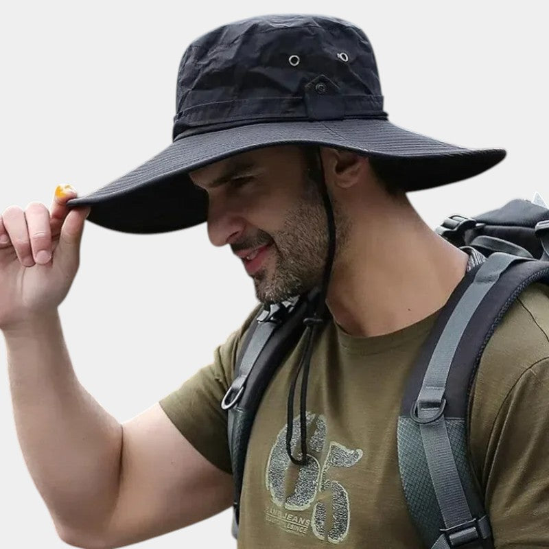 Man wearing a wide brimmed black hat 